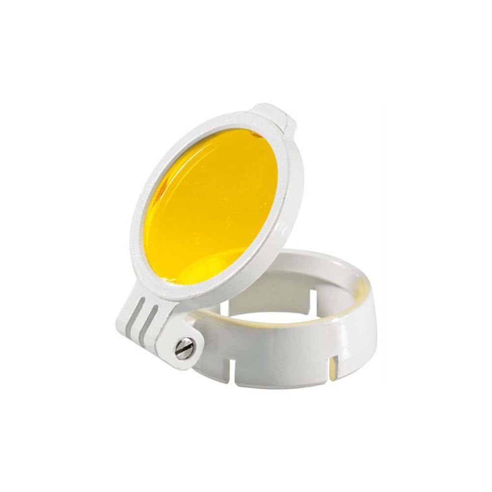 Bright dental curing light with yellow lens for precise dental procedures.